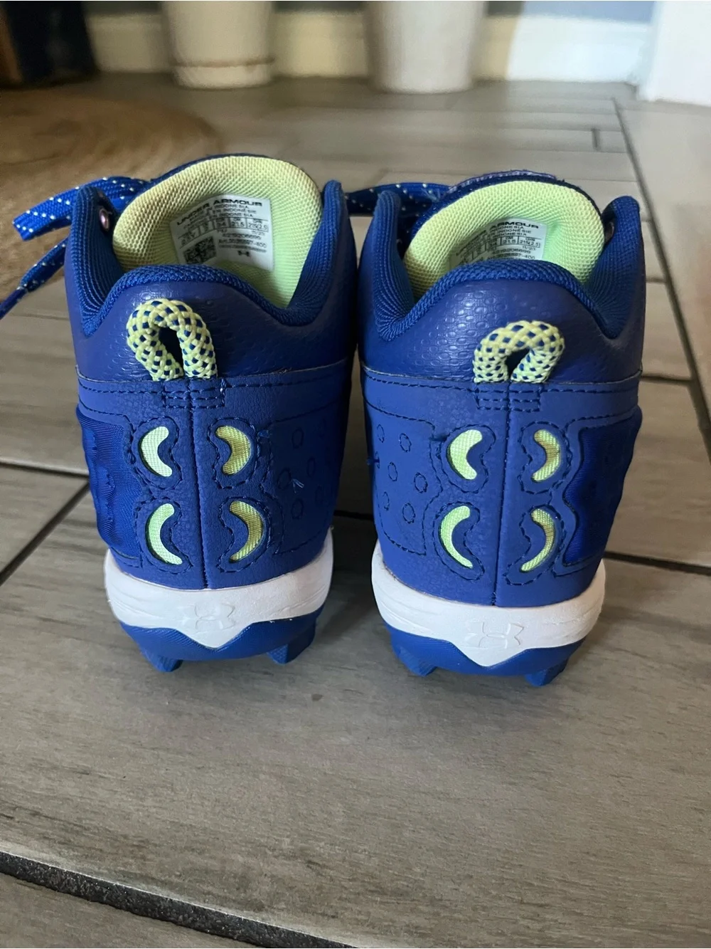 Under Armour Kids White and Blue Cleats with Neon Accents